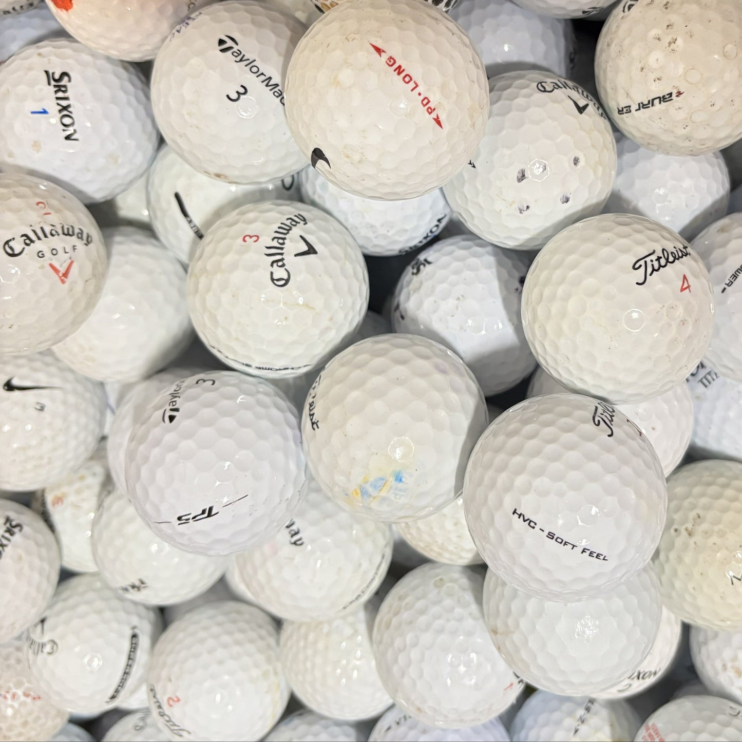 Mixed brand grade B lake golf balls in white and colour including yellow