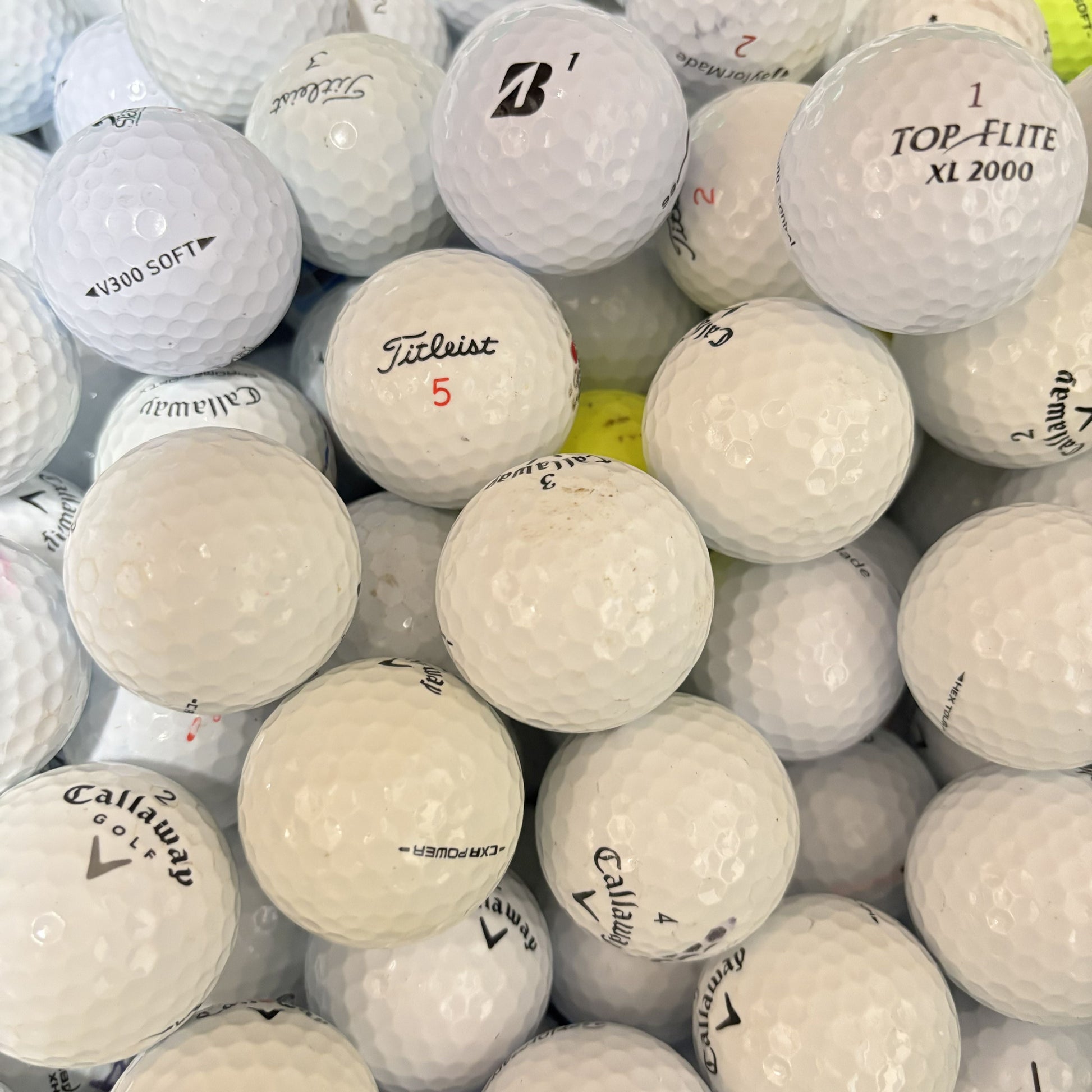 Mixed brand grade A white lake golf balls including Callaway, Titleist, TaylorMade and Bridgestone